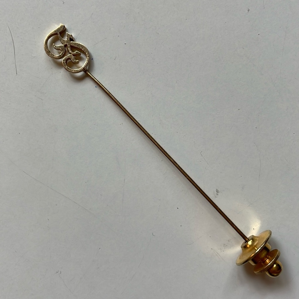 stick pin, script letter “F”, yellow gold plated….